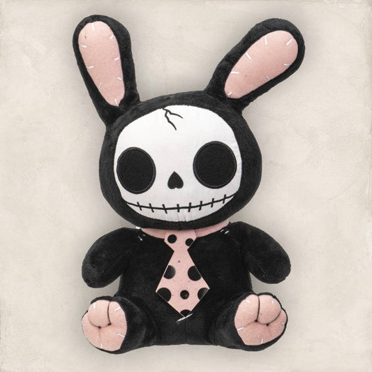 Black plush bunny with skull face, pink inner ears, paws, and spotted tie.