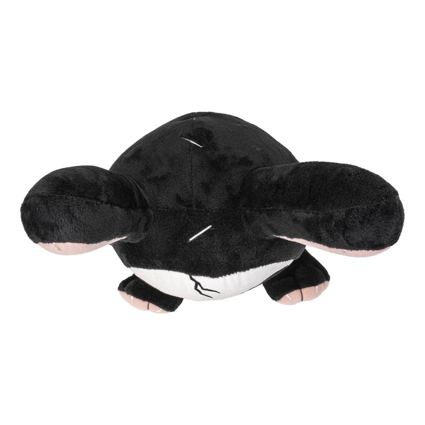 Black plush bunny with large ears and white belly lying flat with eyes closed.