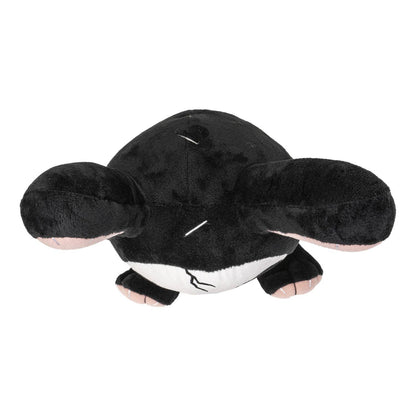 Black plush bunny with large ears and white belly lying flat with eyes closed.
