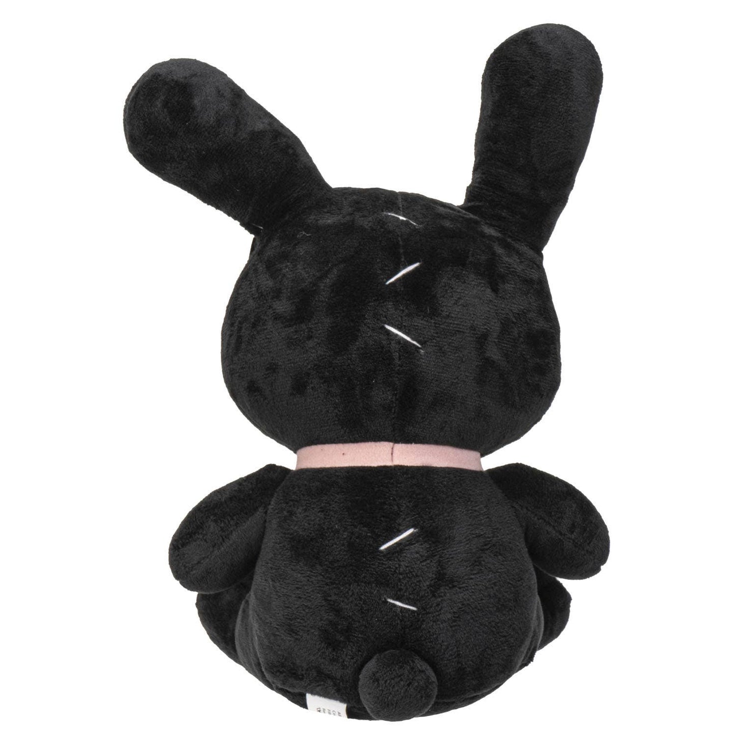 Black plush bunny with long ears, pink collar, and small round tail sitting upright.