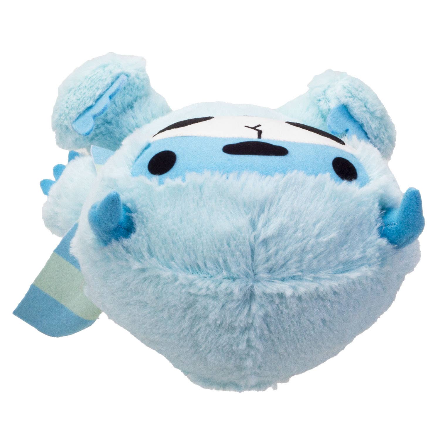 Light blue furry yeti plush with white face, black eyes, and blue horns lying on its back.