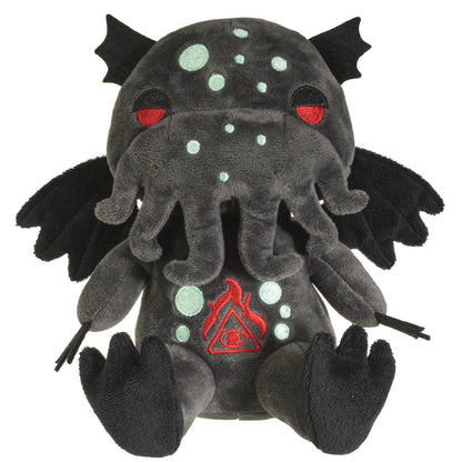 Dark gray plush Cthulhu with red eyes, glowing green spots, wings, and multiple tentacles.