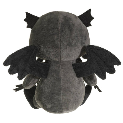 Dark gray plush Cthulhu with black wings and fin-like ears, viewed from behind.