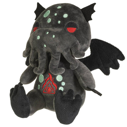 Dark gray plush Cthulhu with red eyes, teal spots, black wings, and tentacle beard.
