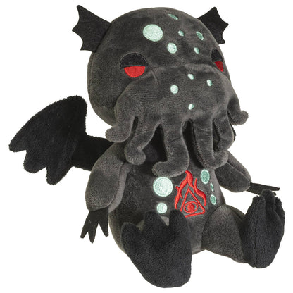 Dark gray plush Cthulhu with red eyes, light green spots, wings, and tentacle beard.