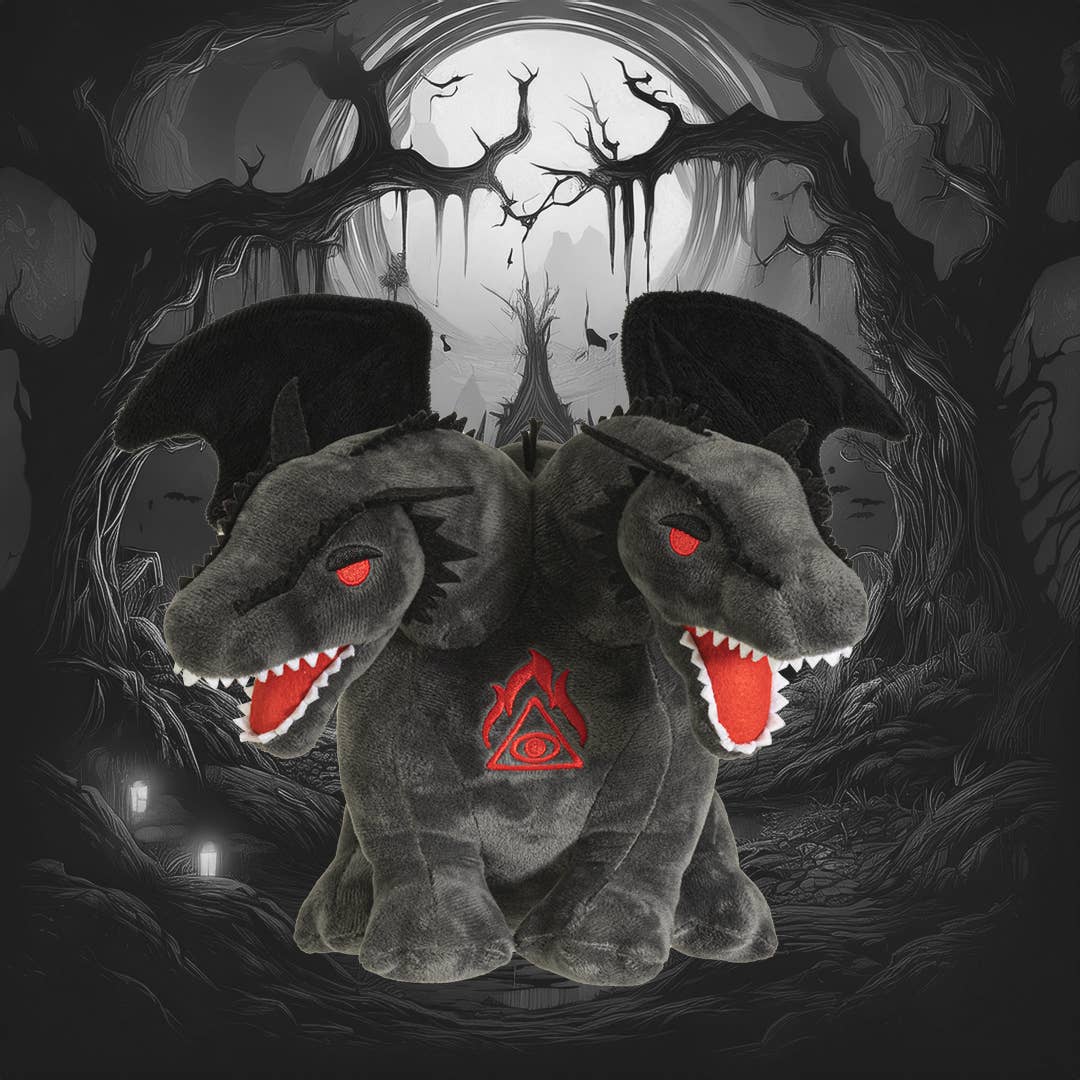 Dark gray double-headed dragon plush with red eyes, open mouths, wings, and a red triangular symbol on chest against a.